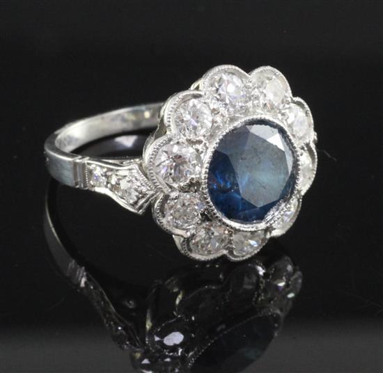 A white gold and fancy colour diamond and white diamond circular cluster ring, size N